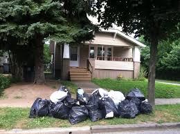 Bags of Trash Sitting on the Sidewalk